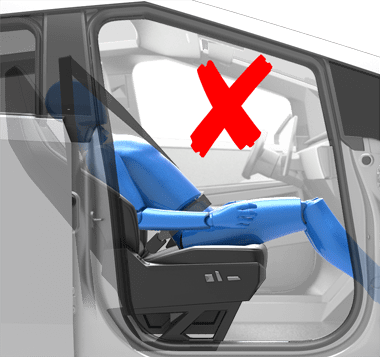 Person sitting in a car seat incorrectly with the backrest in a laying down position