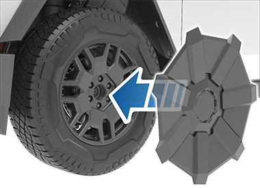 The wheel cover with an arrow pointing inwards toward the wheel