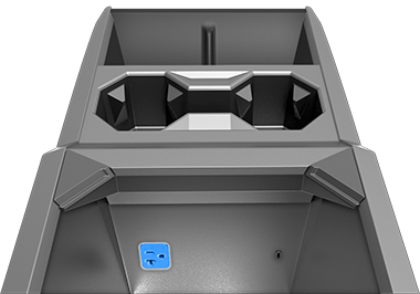Center console with arm rest lifted, revealing power outlet in the compartment