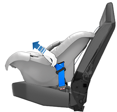 A child seat installed in a seat with a hand pulling on the seat belt